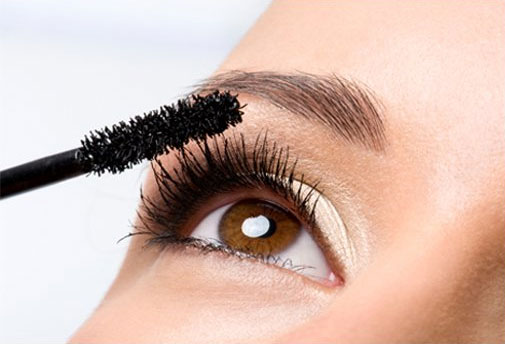 Curl your natural lashes, then apply mascara. Let the mascara dry before applying the lashes.